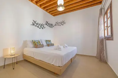 a bedroom with a bed in a room at Filigrana Villa Lindos in Líndos