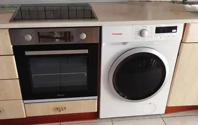 a washer and dryer sitting next to each other at Periklis House in Ixia