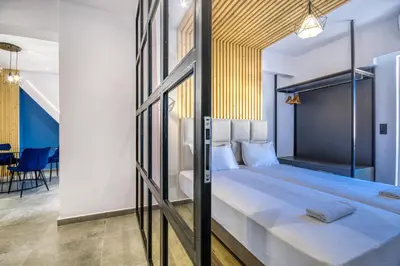 a bedroom with a large bed in a room at Aletreo, Rhodes in Rhodes Town