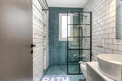 a bathroom with a shower and a toilet and a sink at Aletreo, Rhodes in Rhodes Town