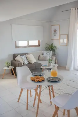 a living room with a table with food on it at Cozy Loft with Private Terrace in Kremasti