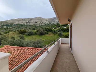 a balcony with a view of the mountains at Tharenos home in Émbonas