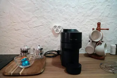 a coffee maker and other items on a table at Stone Living Symi Central Apartments in Symi
