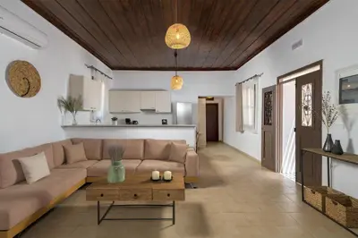 a living room with a couch and a table at Villa Dorinna in Lachania