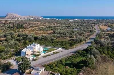 an aerial view of a house and a road at New Loft by Ossiano Pool Villas, Heating Pool,2 min drive to Haraki Beach & 10 to Lindos in Haraki
