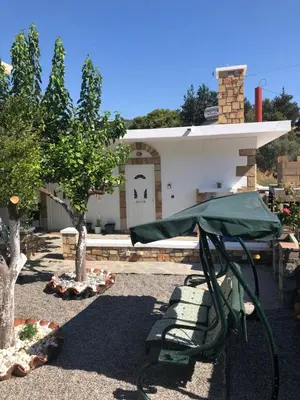 a house with a bike parked in front of it at Villa Jimmy, Pilona Village in vlicha