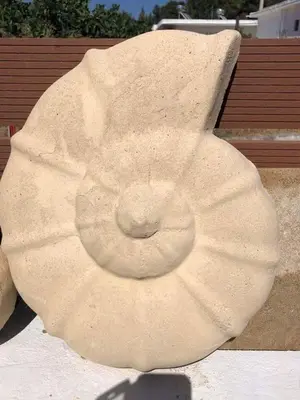 a statue of a doughnut sitting on the ground at Villa Jimmy, Pilona Village in vlicha