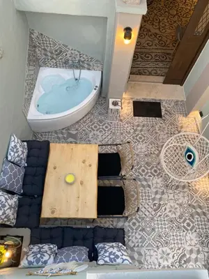 an overhead view of a bathroom with a tub at Kyrangelo Traditional House with outdoor jacuzzi in Koskinou
