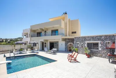 a villa with a swimming pool and a house at Des & Coo Luxury Villa with Private Pool in Faliraki