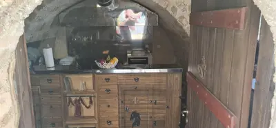 a kitchen with a counter and an archway in a room at The Dragon of Rodos in Rhodes Town