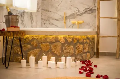a group of candles in a bathroom with a tub at Demar luxury villa in Rhodes Town
