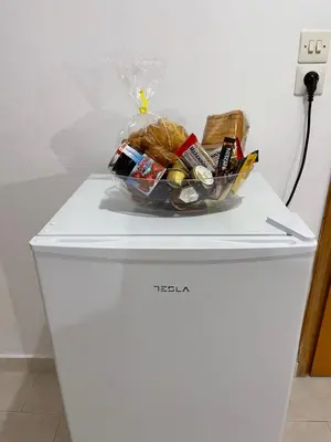 a bowl of food sitting on top of a refrigerator at Anastasia Apartment in Afantou