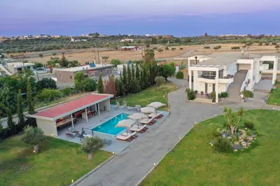 an aerial view of a house with a swimming pool at Villa Nikoli in Kolimbia