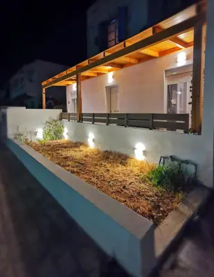 a balcony with lights on the side of a building at Blue View Zefiros in Rhodes Town