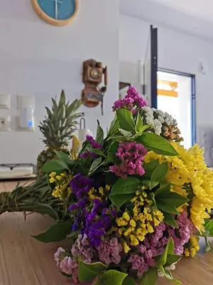 a bouquet of flowers sitting on top of a table at Blue View Zefiros in Rhodes Town