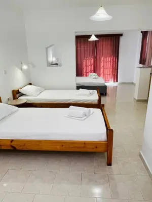 a room with three beds in it at Anastasia Apartment 9 in Afantou
