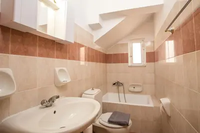 a bathroom with a sink and a toilet at Anastasia Apartment 9 in Afantou
