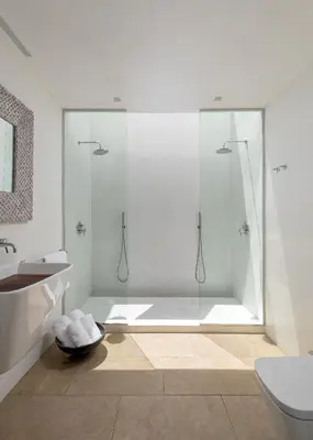 a bathroom with a shower and a tub and a sink at Aquavisionaire Beach Front Villa in Líndos