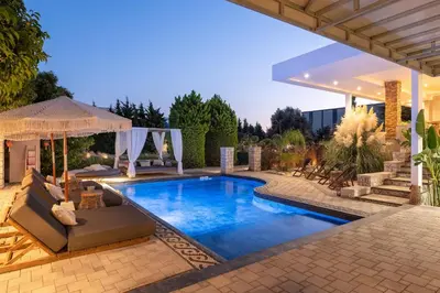 a swimming pool in a backyard with a pavilion at Vento Imperiale Estate in Rhodes Town