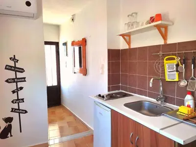 a kitchen with a sink and a counter top at Small apartment (studio) in town with sea view in Rhodes Town