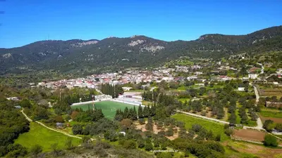 an aerial view of a town in the mountains at Greenview Maisonnette in Apóllona