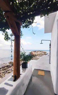 a view of the ocean from a house at Stegna Rita's apartment in Archangelos