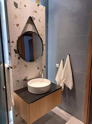a bathroom with a sink and a mirror on a counter at Courtyard Luxury Suites “MARIANTHI” in Pefki Rhodes