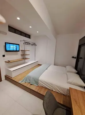 a bedroom with a large bed and a desk at Courtyard Luxury Suites “MARIANTHI” in Pefki Rhodes