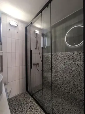 a shower with a glass door in a bathroom at Casa Manny in Rhodes Town