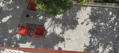 a shadow of a tree on the side of a building at Casa Manny in Rhodes Town