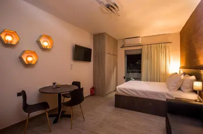a hotel room with a bed and a small table at Oleana di Castello in Rhodes Town