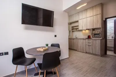 a kitchen and dining room with a table and chairs at Oleana di Castello in Rhodes Town