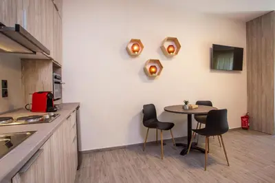 a kitchen with a table and chairs in a room at Oleana di Castello in Rhodes Town