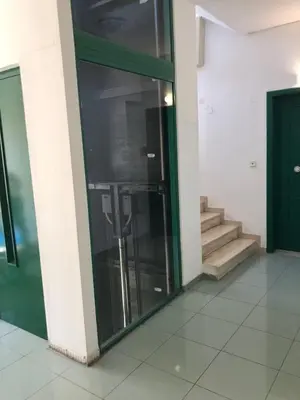 a glass door in a building with a staircase at Paraskevi's Apt - City Center w/ Lovely Park View in Rhodes Town
