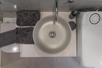 a bathroom with a sink with a sink at Villa Iliousa Grand in Psinthos