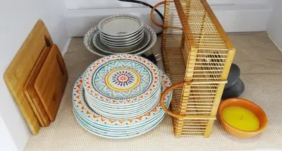 a pile of plates and bowls sitting on a counter at Callas Residence in Triánta