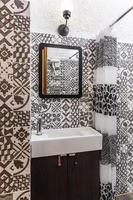 a bathroom with a sink and a mirror at Emmanuel Apartments in Rhodes Town