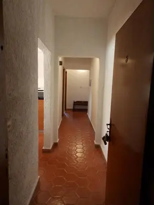 an empty hallway with a hallway leading into a room at Emmanuel Apartments in Rhodes Town