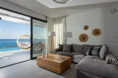 a living room with a couch and a table at Villa Auretta in Pefki Rhodes