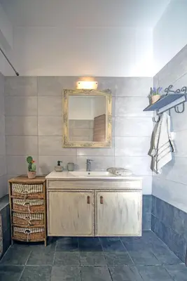 a bathroom with a sink and a mirror at Loft style apartment near the Old Town in Rhodes Town