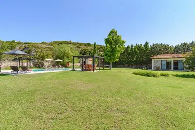 a large yard with a gazebo and a pool at Villa Amarandes With Private Pool in Paradeísion