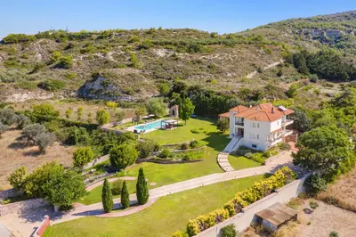 an aerial view of a house on a hill at Villa Amarandes With Private Pool in Paradeísion