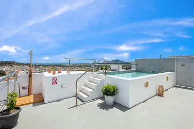 a hot tub on the roof of a house at Afandou Panorama Apartment in Afantou