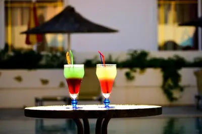 two drinks are sitting on a table at Stegna Sunrise Suite Sleeps 4 Pool in Archangelos