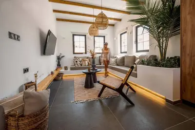 a living room with a person standing in the middle of the room at CasaCarma III, private pool, boho design, central in Lachania