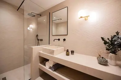 a bathroom with a sink and a mirror and a shower at CasaCarma II, private pool, boho design, tradition in Lachania