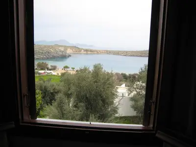 a view of a lake from a window at Eleftheria Lindian Studios I in Líndos