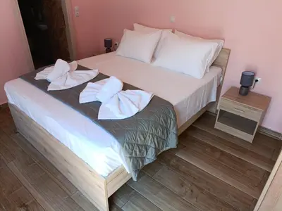 a bedroom with a bed with towels on it at Lindos Villa Euphoria in Líndos