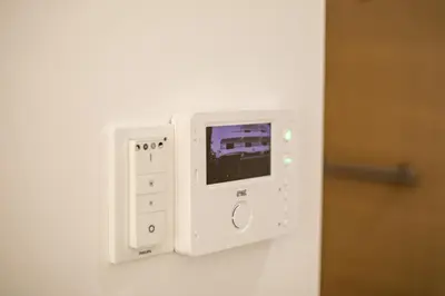 a white electrical outlet on a white wall at Aetheria Central Apartments in Rhodes Town