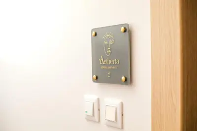 a sign on a wall next to a door at Aetheria Central Apartments in Rhodes Town